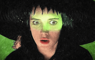 A digital painting of a person wearing a black witch hat, looking surprised. the face is in shock, with wide green eyes and open mouth, amidst a dark green background.