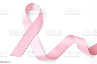 A pink ribbon, symbolizing breast cancer awareness, is gracefully laid out against a pure white background.