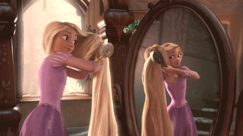 Animated character rapunzel from "tangled" looks at herself in the mirror, playfully pulling on her long, blonde braid, while her chameleon friend pascal mimics her actions.
